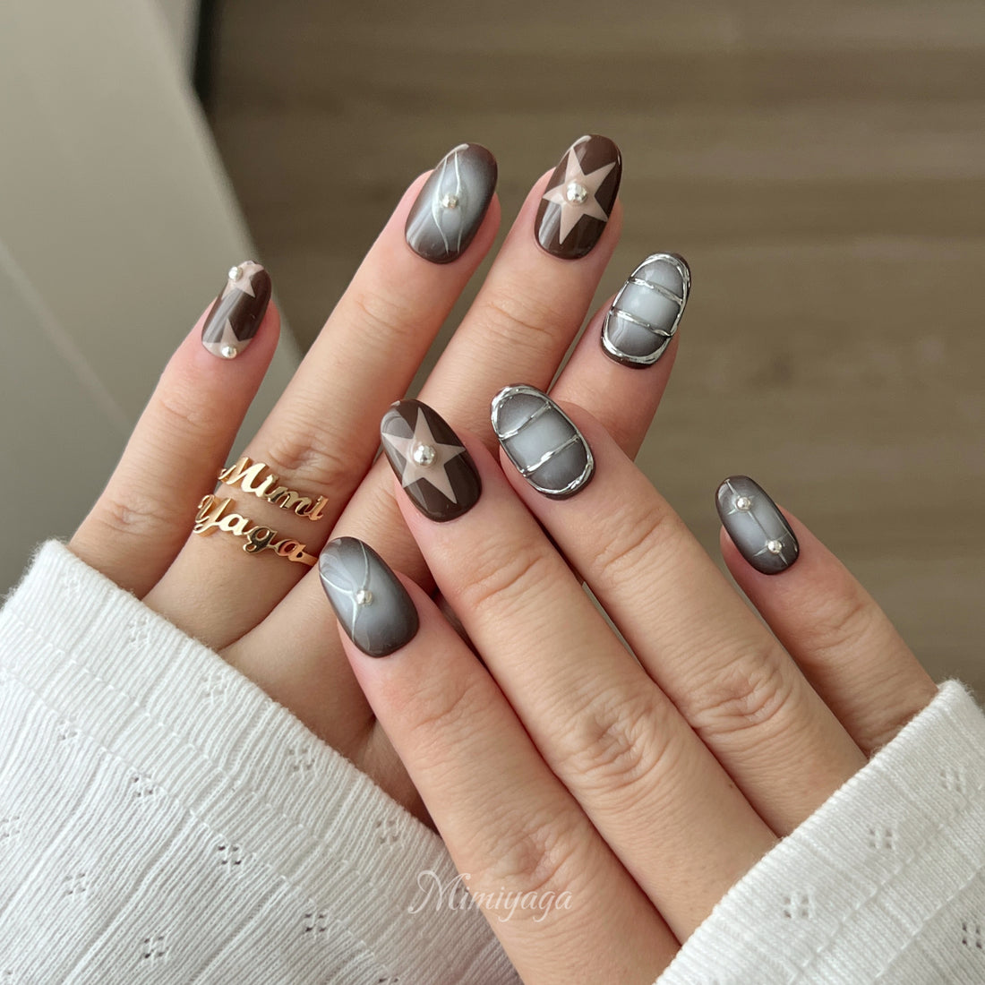 Mocha Muse handmade press on nails with chocolate brown, white airbrush, silver hearts and metallic details