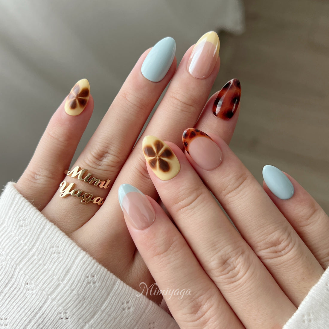 Afterglow handmade press on nails with amber leopard blending, soft blue, butter yellow and nude details