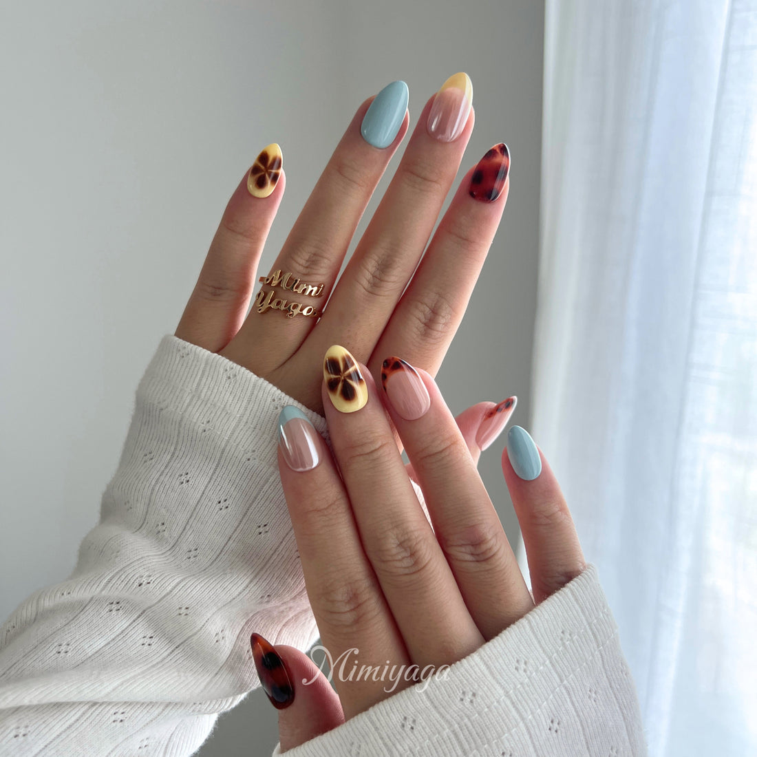 Afterglow handmade press on nails with amber leopard blending, soft blue, butter yellow and nude details