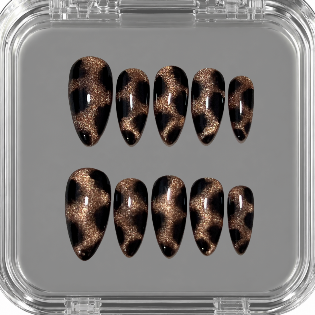 Golden Prowl handmade press on nails with brown cat eye shimmer and softly blended black leopard details