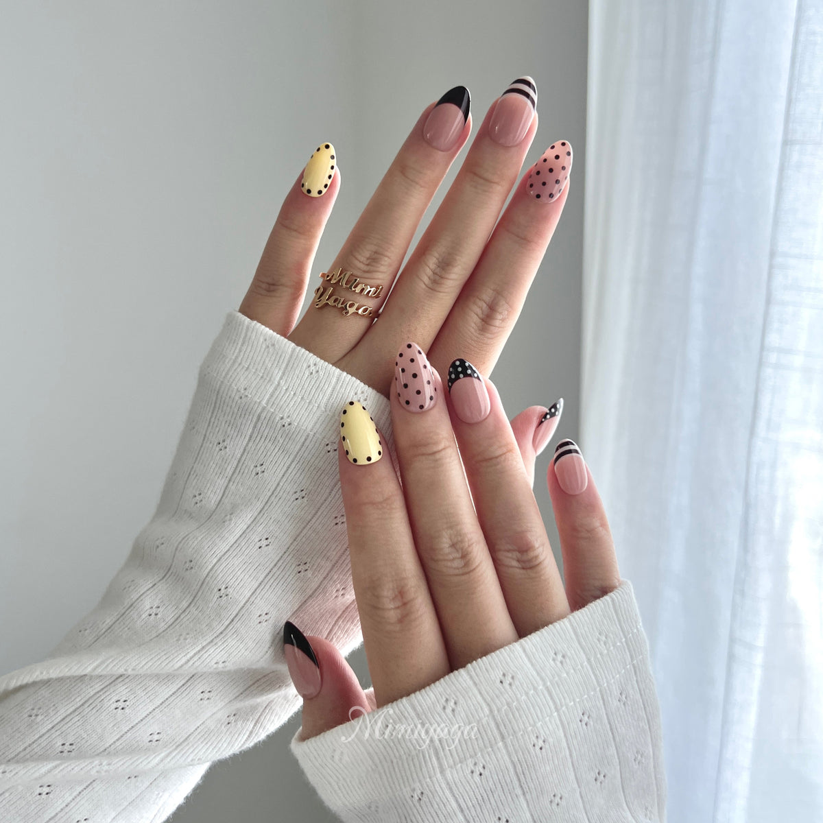 Sunday Best blush, butter yellow and burgundy mismatched press on nails worn on hands